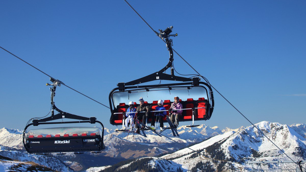 Skiers on a chairlift