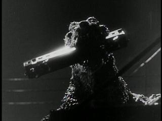 Godzilla Picks Up A Train With His Mouth