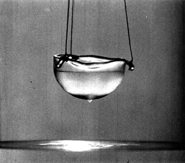 Shows Rollin
                      Film forming on the bottom of a cup of superfluid
                      liquid helium.