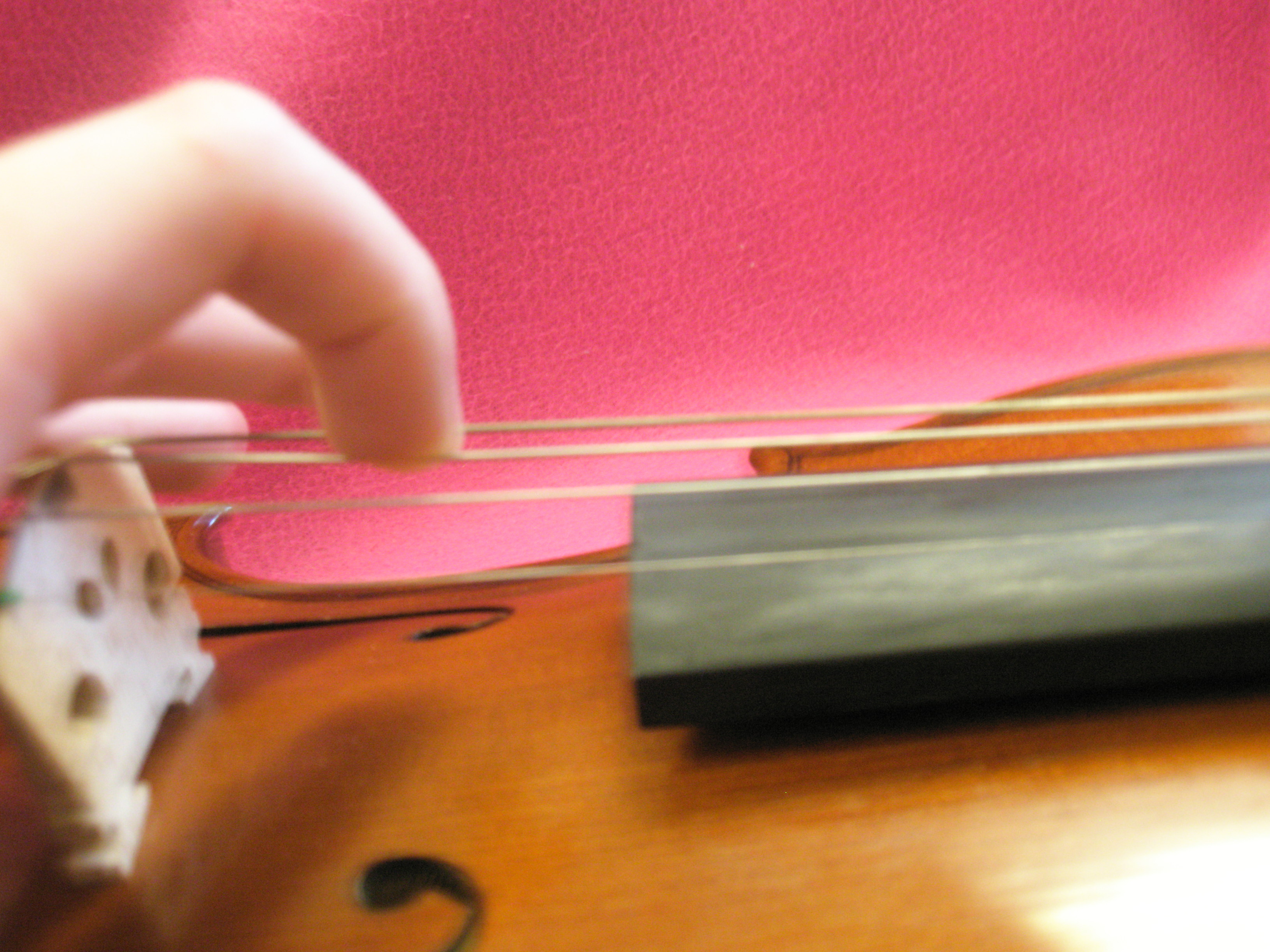 Plucking a violin string
